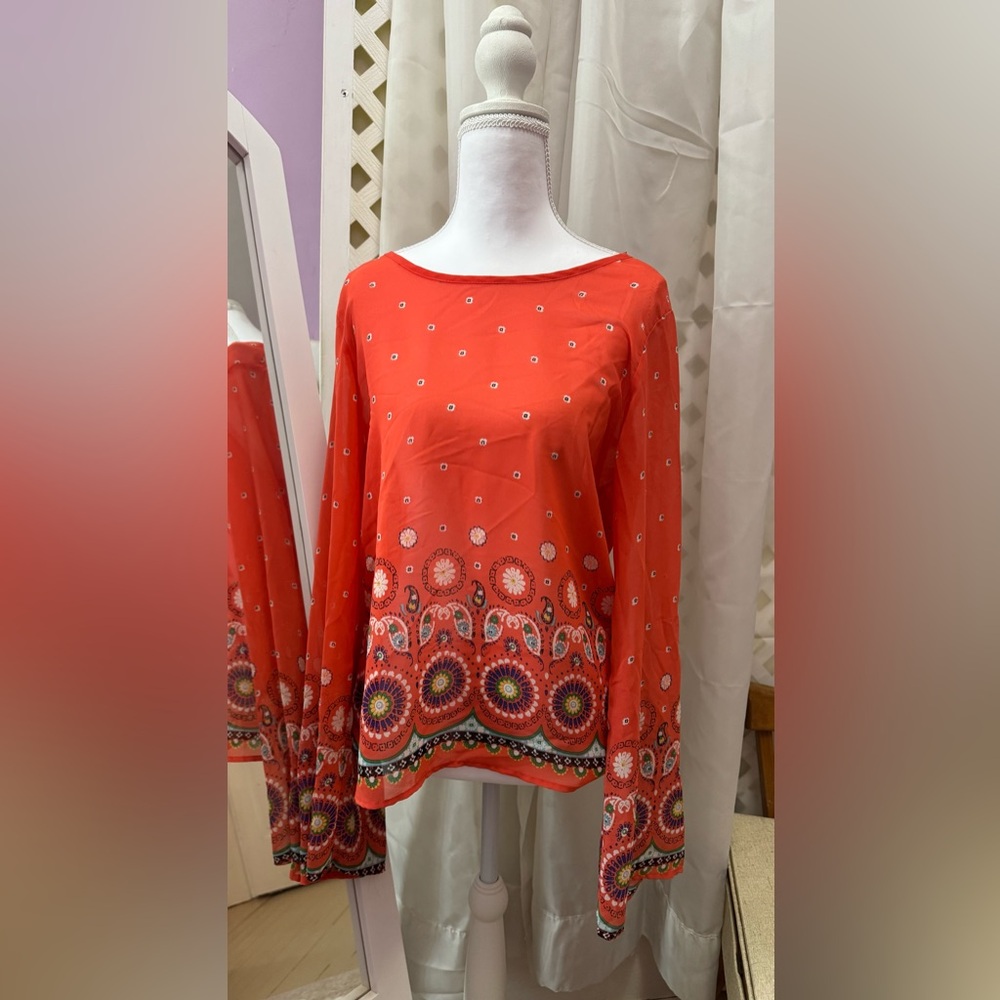 Vibrant Orange Blouse with Artistic Hem
